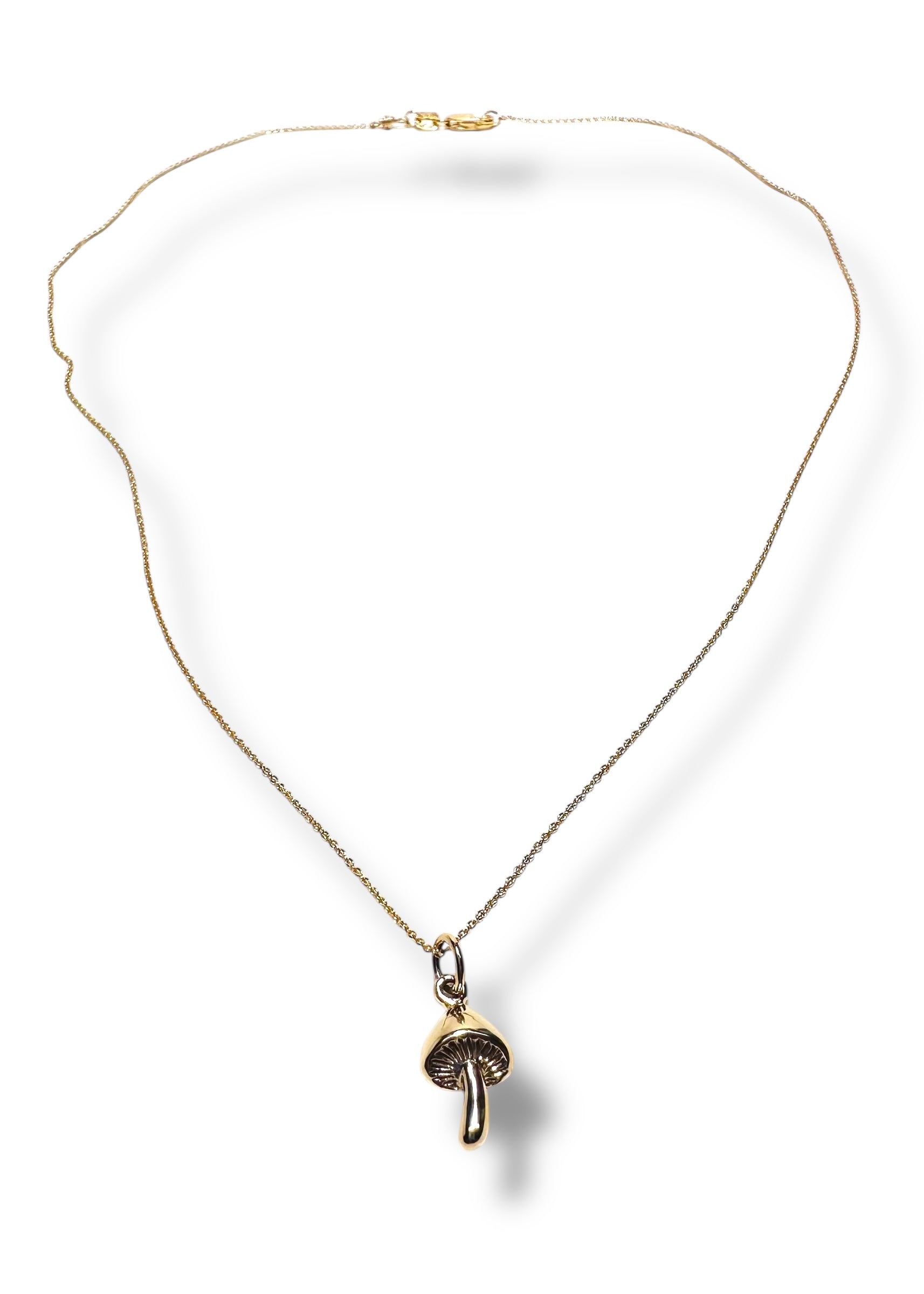 Close-up of Dainty Golden Mushroom Necklace* pendant