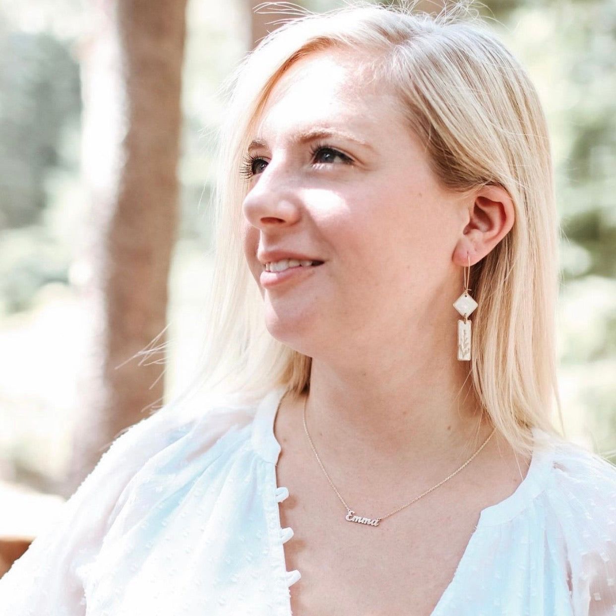 Woman wearing Midas Deco Earrings - Art Dangle, styled with a white blouse and personalized necklace, perfect for gifting or special occasions.