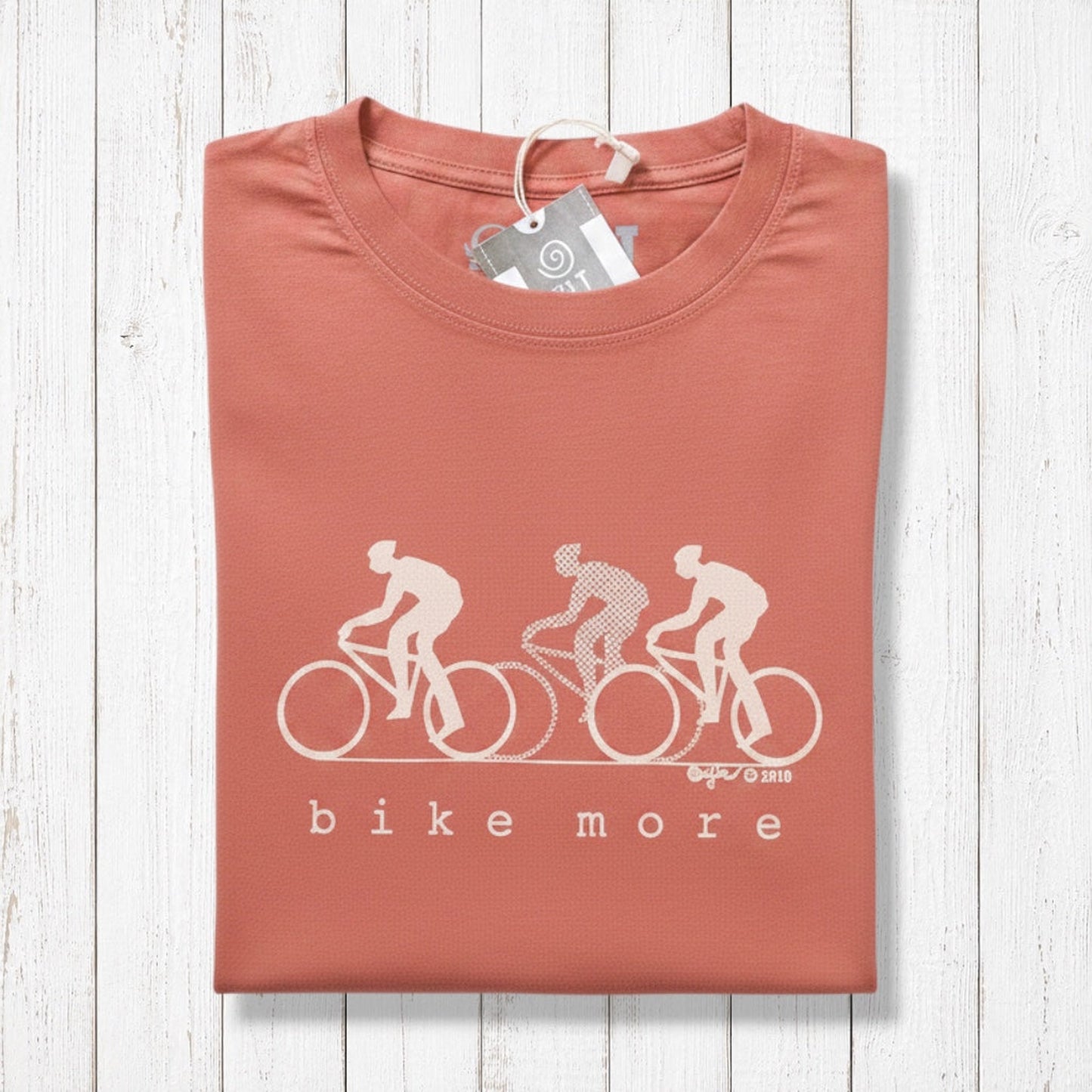 Uni-T Bike More graphic t-shirt in terracotta red featuring a minimalist white cycling print on soft bamboo cotton.