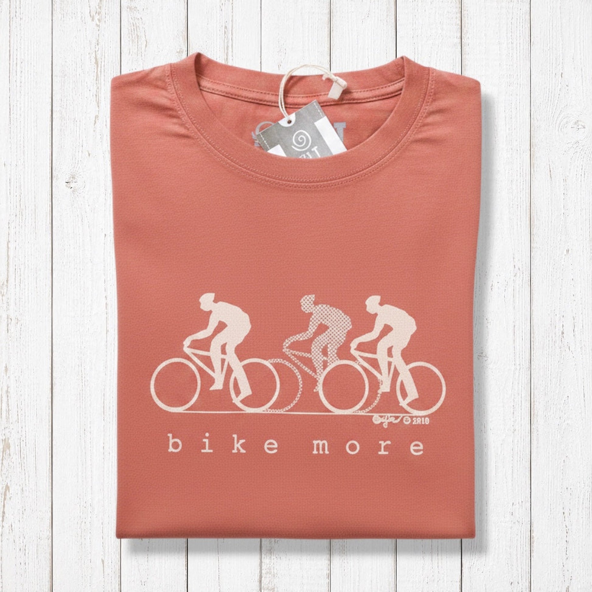 Uni-T Bike More graphic t-shirt in terracotta red featuring a minimalist white cycling print on soft bamboo cotton.
