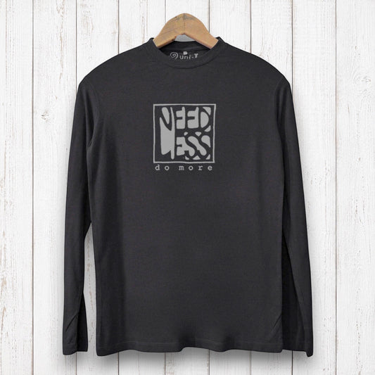 Uni-T black long sleeve bamboo graphic tee with Need Less Do More typography on a white wood background