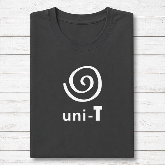 Uni-T black bamboo and organic cotton t-shirt with a white spiral unity graphic, neatly folded on a white wood surface.