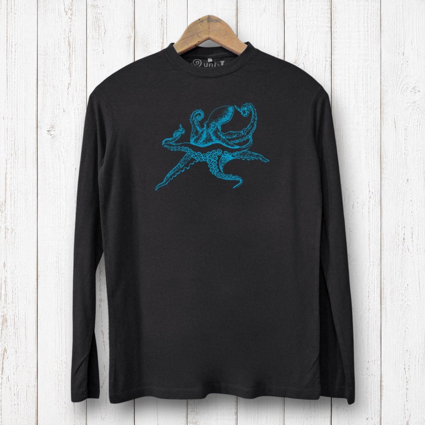 Uni-T black long sleeve bamboo and organic cotton t-shirt featuring a blue octopus graphic on a rustic wood background.
