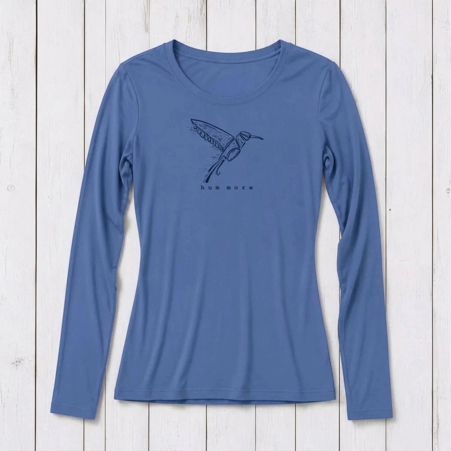 Uni-T blue long sleeve crew neck t-shirt made from soft bamboo and organic cotton blend on a white wooden background.