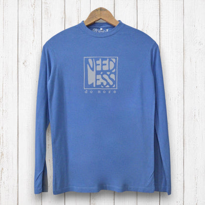 Uni-T blue long sleeve bamboo and organic cotton graphic tee featuring Need Less Do More typography on a wood background