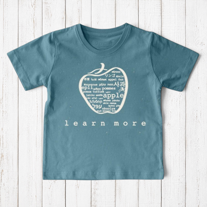 Uni-T kids organic cotton t-shirt in blue with a white hand-illustrated apple graphic featuring global languages