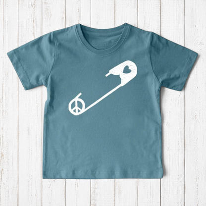 Uni-T kids organic cotton t-shirt in blue featuring a white safety pin graphic with a peace sign and heart detail.
