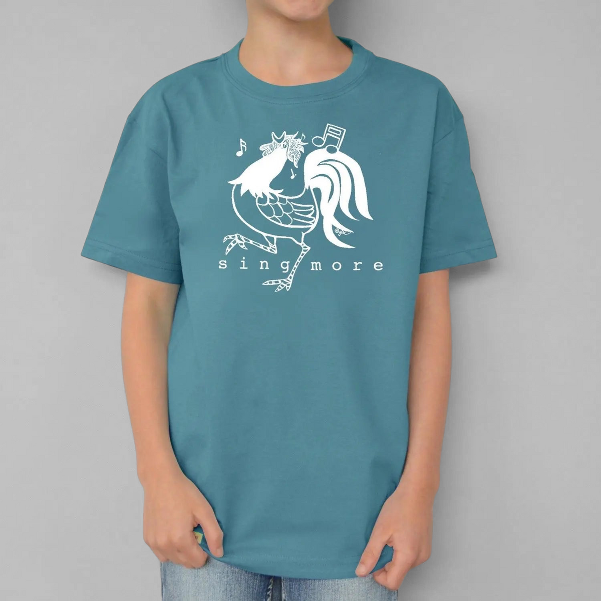 Uni-T kids organic cotton blue t-shirt featuring a white hand-illustrated rooster graphic with Sing More text