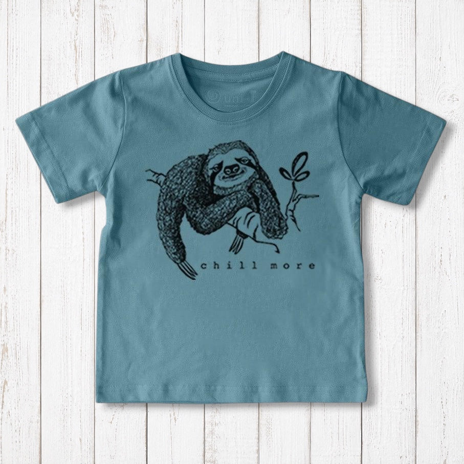 Uni-T kids' blue organic cotton t-shirt featuring a hand-illustrated black sloth graphic with the text Chill More