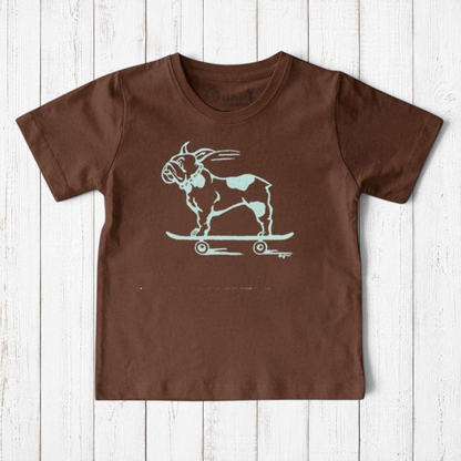 Uni-T kids brown organic cotton t-shirt featuring a hand-illustrated white French Bulldog riding a skateboard