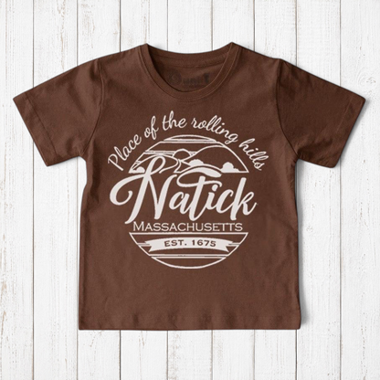 Uni-T brown organic cotton kids t-shirt with a white Natick Massachusetts circle graphic logo design