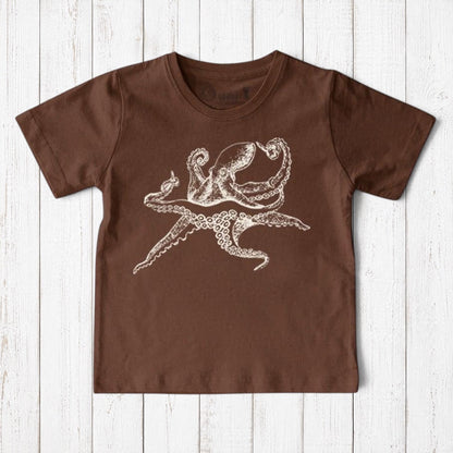 Uni-T kids brown organic cotton t-shirt featuring a white hand-illustrated octopus graphic on a rustic wood background