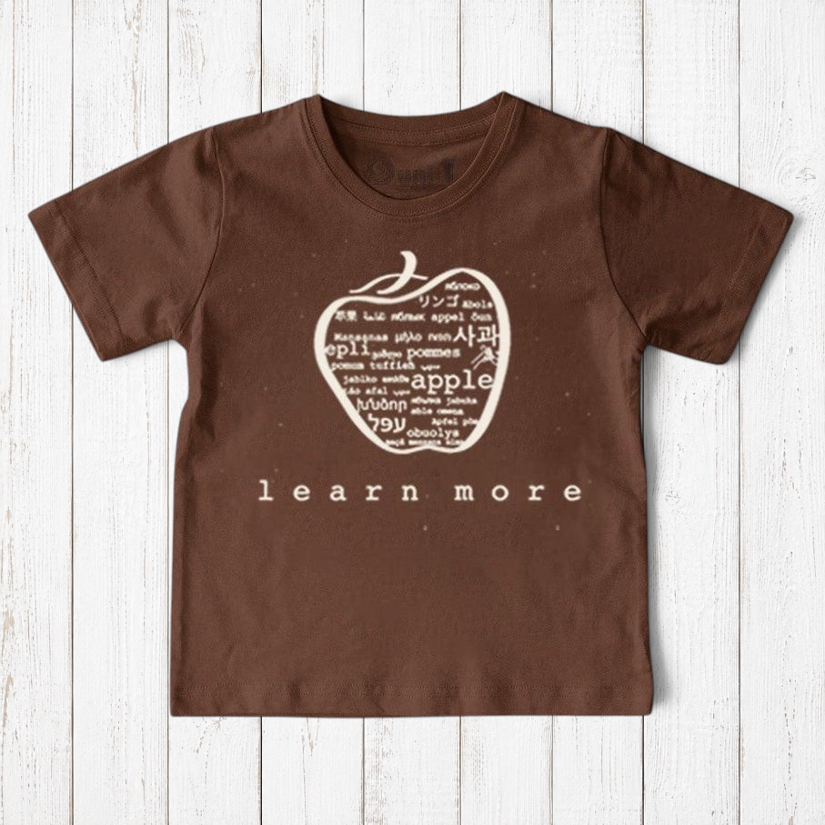 Uni-T brown organic cotton kids t-shirt featuring a white hand-illustrated apple graphic with multilingual text.