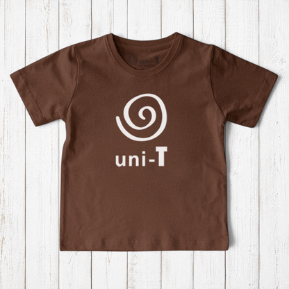 Uni-T kids brown organic cotton t-shirt featuring a white spiral unity graphic logo on a rustic wooden background.