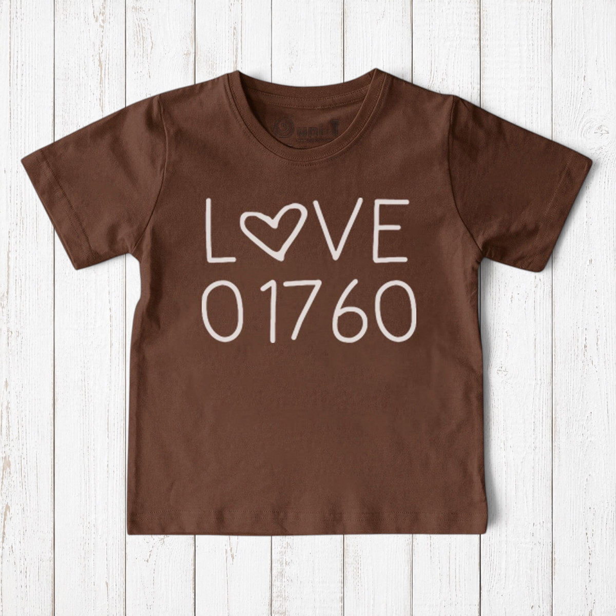 Uni-T brown organic cotton kids t-shirt featuring a white hand-drawn Love 01760 graphic for Natick pride