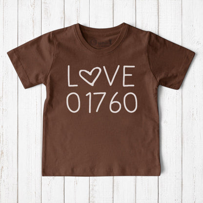 Uni-T brown organic cotton kids t-shirt featuring a white hand-drawn Love 01760 graphic for Natick pride
