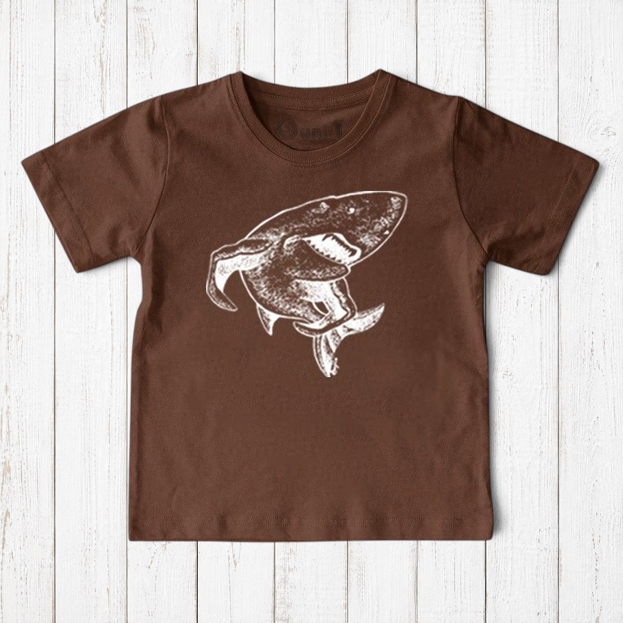 Uni-T kids brown organic cotton t-shirt featuring a white hand-illustrated shark graphic from a children's book.