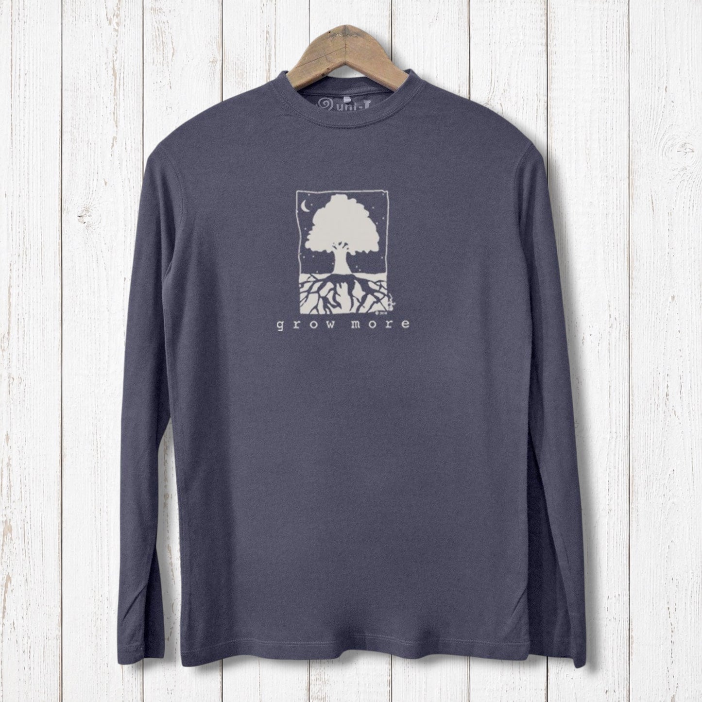 Uni-T men's long sleeve t-shirt in charcoal grey featuring a white Grow More tree graphic on a rustic wood background.