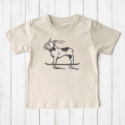 Uni-T kids organic cotton t-shirt in cream featuring a hand-illustrated black French Bulldog riding a skateboard.