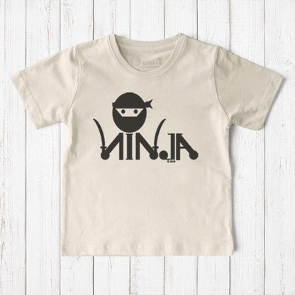 Uni-T kids organic cotton t-shirt in cream featuring a black ninja graphic for active play and martial arts