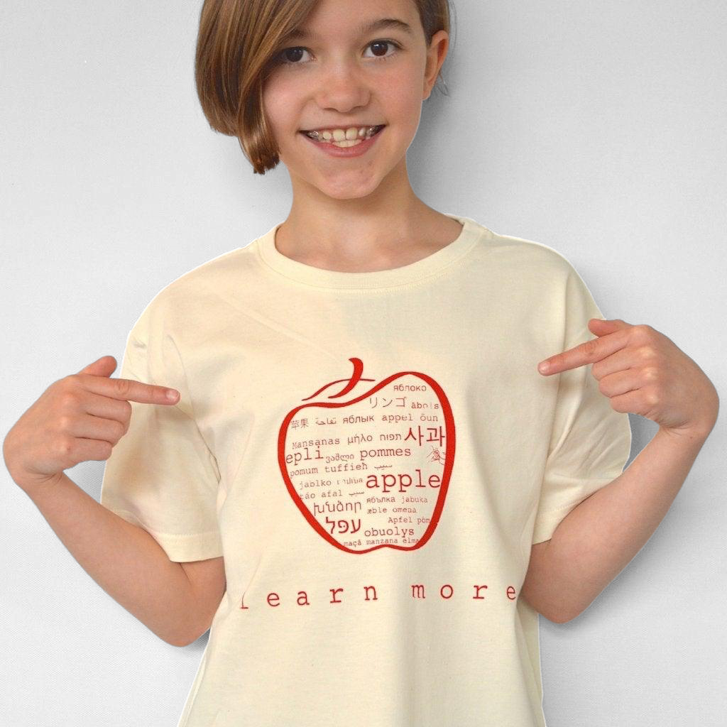 Uni-T kids organic cotton cream t-shirt featuring a red apple graphic with the word apple in many languages