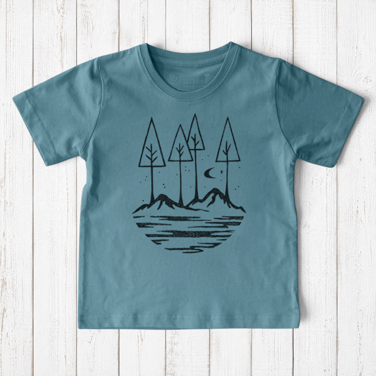Uni-T kids organic cotton t-shirt in dusty blue with a black hand-illustrated nature graphic of trees and moon