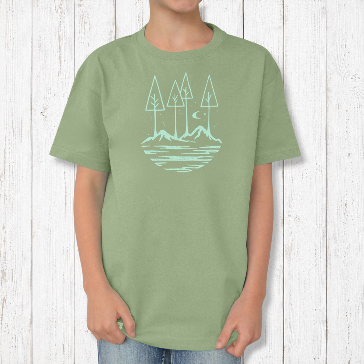 Uni-T kids organic cotton t-shirt in sage green with a hand-illustrated nature graphic of trees, river, and moon.