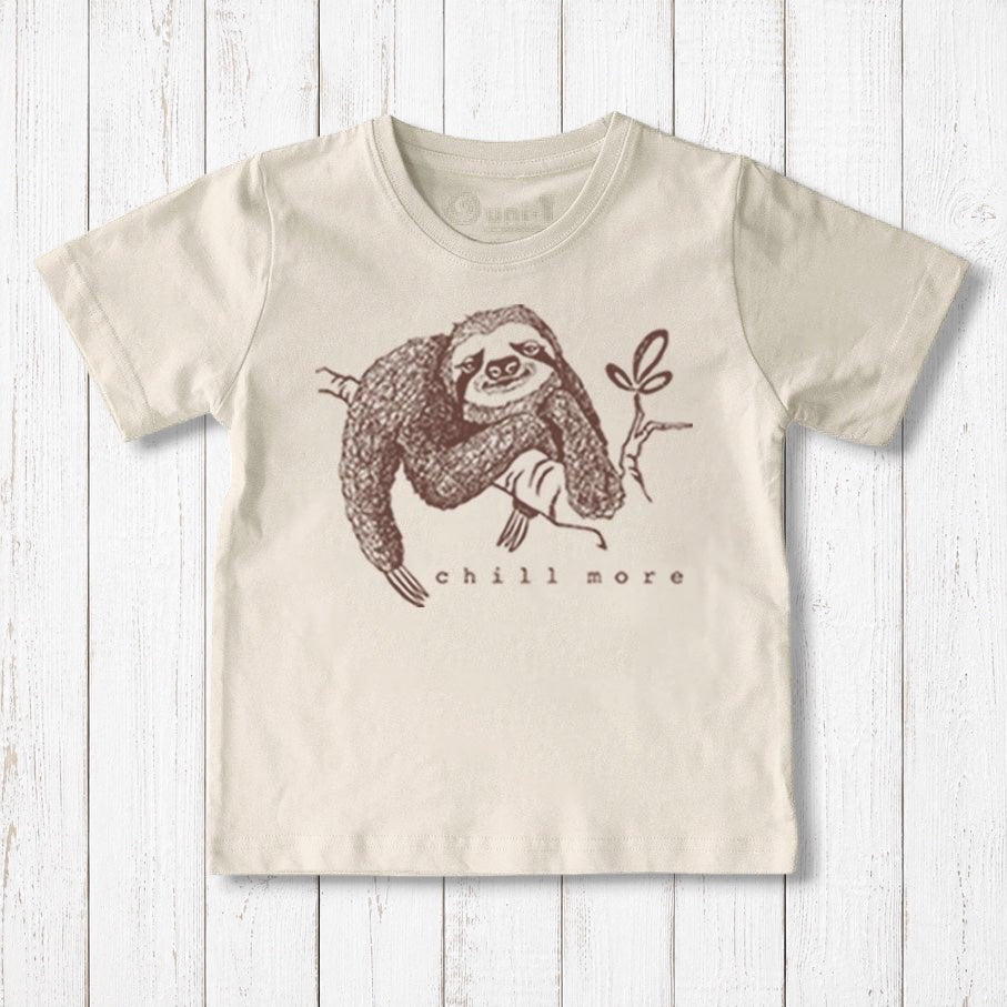 Uni-T kids organic cotton t-shirt in cream featuring a brown hand-illustrated sloth graphic with Chill More text