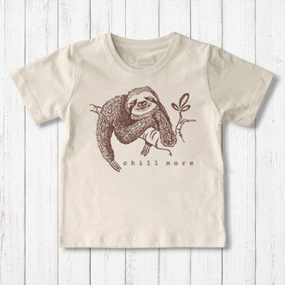 Uni-T kids organic cotton t-shirt in cream featuring a brown hand-illustrated sloth graphic with Chill More text
