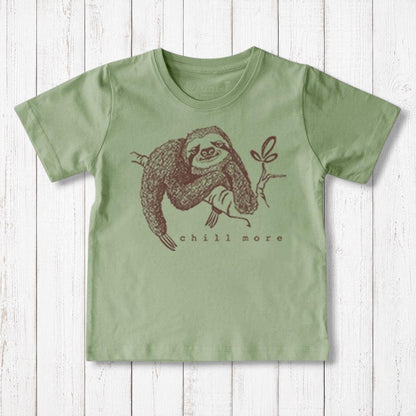 Uni-T kids organic cotton t-shirt in sage green featuring a brown hand-illustrated sloth graphic with Chill More text.