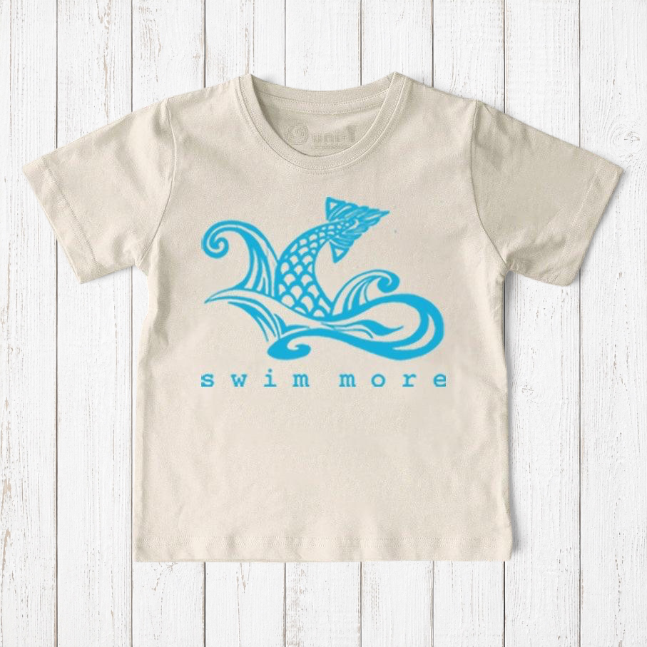 Uni-T kids organic cotton t-shirt in cream with a blue hand-drawn mermaid tail graphic and Swim More text