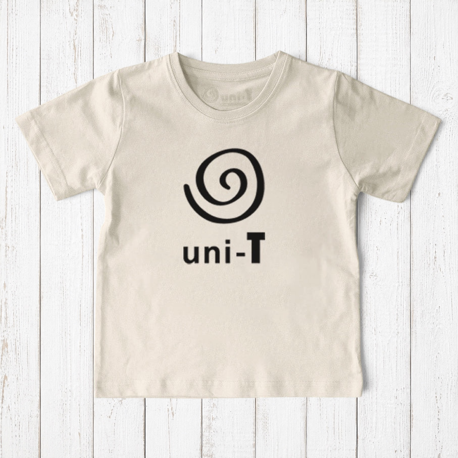 Uni-T kids organic cotton t-shirt in natural beige with a black spiral unity graphic logo on a rustic wood background