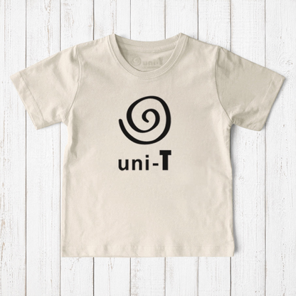 Uni-T kids organic cotton t-shirt in natural beige with a black spiral unity graphic logo on a rustic wood background