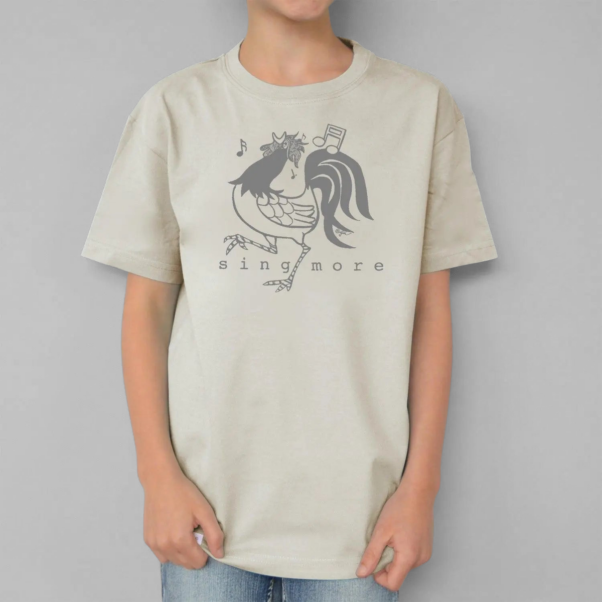 Uni-T kids organic cotton t-shirt in beige featuring a hand-illustrated grey rooster graphic with musical notes.