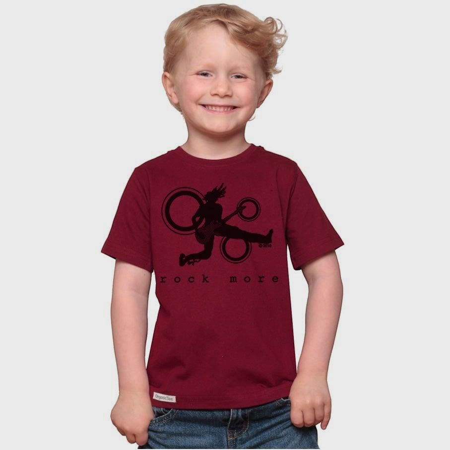 A smiling young boy wearing a maroon Uni-T organic cotton t-shirt with a black Rock More guitar graphic print.