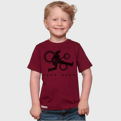 A smiling young boy wearing a maroon Uni-T organic cotton t-shirt with a black Rock More guitar graphic print.