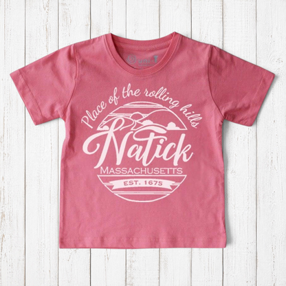 Uni-T kids pink organic cotton t-shirt featuring a white Natick Massachusetts circle logo graphic design