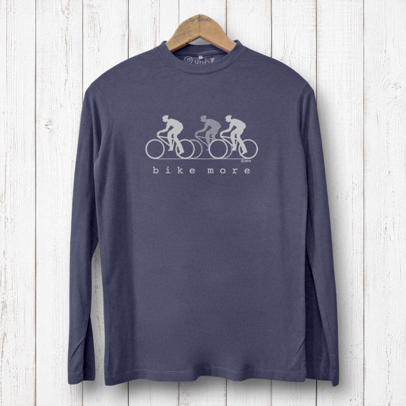 Uni-T men's navy bamboo long sleeve t-shirt with white Bike More graphic print on a rustic white wood background.