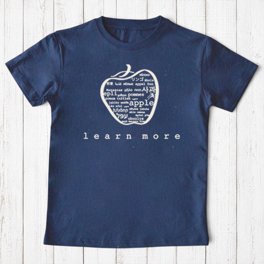 Uni-T navy blue organic cotton kids t-shirt featuring a white hand-illustrated apple graphic with multilingual text