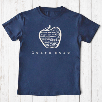 Uni-T navy blue organic cotton kids t-shirt featuring a white hand-illustrated apple graphic with multilingual text