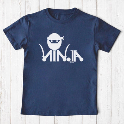 Uni-T navy blue organic cotton kids t-shirt with a white ninja graphic and text on a white wooden background