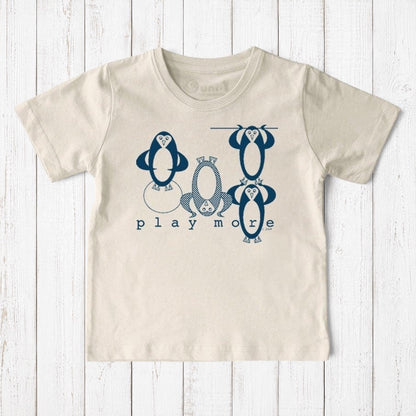 Uni-T kids organic cotton t-shirt in cream with a blue hand-illustrated penguin graphic and Play More text