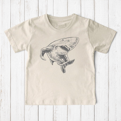 Uni-T kids organic cotton t-shirt in cream with a hand-illustrated grey shark graphic from a children's book.