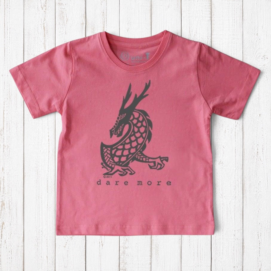 Uni-T kids organic cotton t-shirt in pink featuring a black hand-illustrated dragon graphic with Dare More text