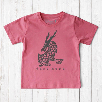 Uni-T kids organic cotton t-shirt in pink featuring a black hand-illustrated dragon graphic with Dare More text