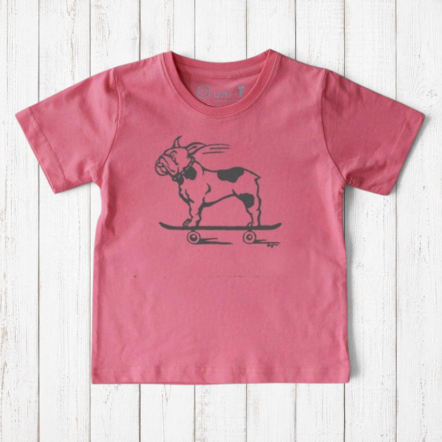 Uni-T kids organic cotton t-shirt in pink featuring a hand-illustrated French Bulldog riding a skateboard