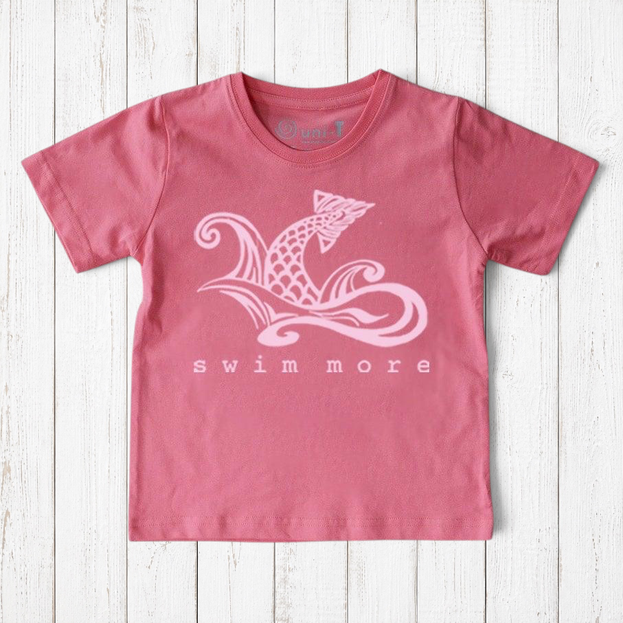 Uni-T kids organic cotton t-shirt in dusty pink with a white hand-drawn fish tail graphic and Swim More text.