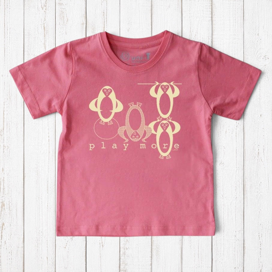 Uni-T kids pink organic cotton t-shirt featuring a playful hand-illustrated penguin graphic and Play More text