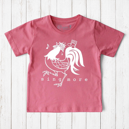 Uni-T kids pink organic cotton t-shirt featuring a white hand-illustrated rooster graphic with Sing More text