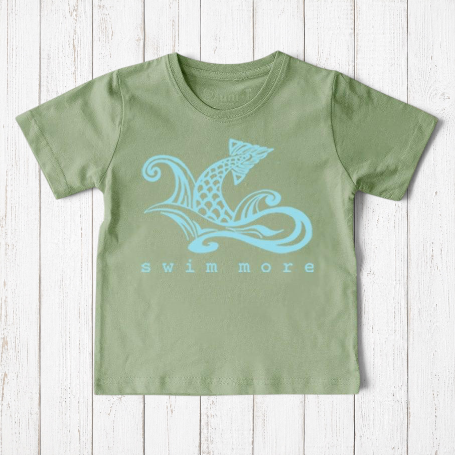 Uni-T sage green organic cotton kids t-shirt featuring a hand-illustrated blue fish graphic and Swim More text.